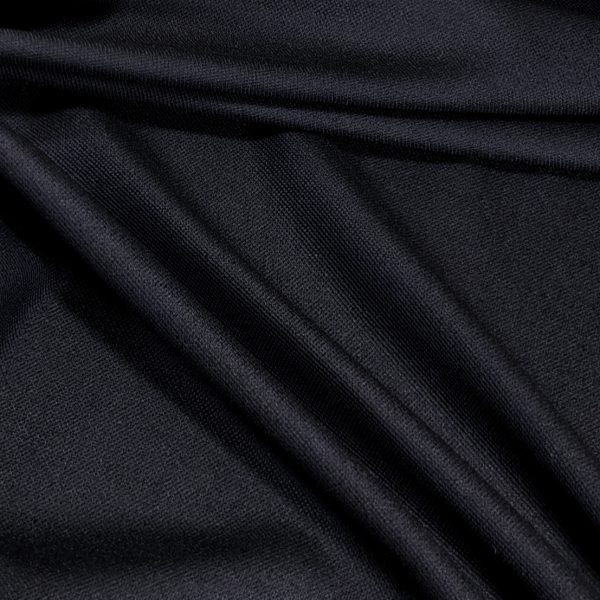 Sinimusta pukuvillakangas neitsytvillaa